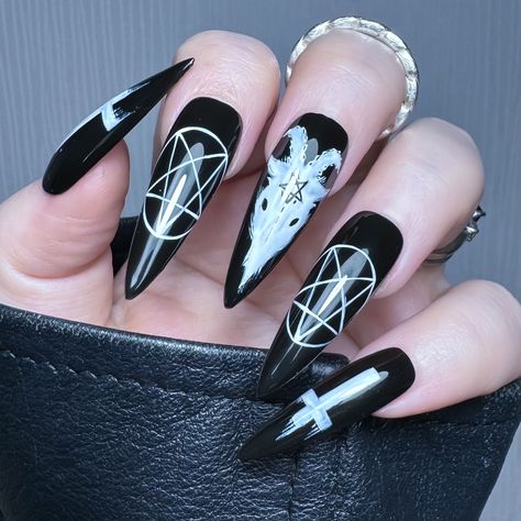 The Core Collection Unleash your dark side with a white hand painted Baphomet inspired design on a black background! Purchase includes; 10 x Apres Gel X Soft Gel Cover Tips 1 x Sizing Kit*1 x Application Kit (Nail File, Cuticle Pusher & Nail Glue OR Adhesive Tabs) See All from Collection: The Core Collection → Long Goth Acrylic Nails, 666 Nails Designs, Alt Nails Aesthetic, Goth Coffin Acrylic Nails, Cute Nails Grunge, Baphomet Nails, Ouija Nail Art, Gothic Holiday Nails, Clown Nail Designs