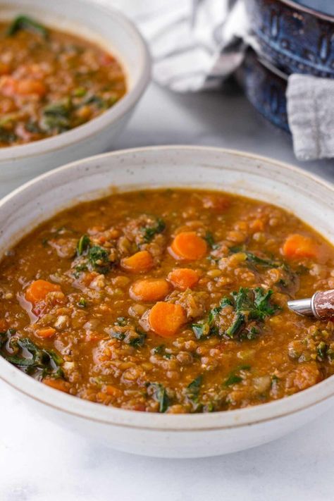 Upgrade your lentil soup game with this flavorful Lentil Kale Soup! Loaded with aromatic spices, hearty lentils, and nutritious kale and carrots, it's perfect for a nourishing meal. This lentil soup is meal prep and freezer friendly. Lentil And Cabbage Soup, Lentil Kale Soup, Lentil Kale, Ham And Lentil Soup, Carrot And Lentil Soup, Kale Soup, Seasonal Produce, Inflammatory Diet, Fried Cabbage