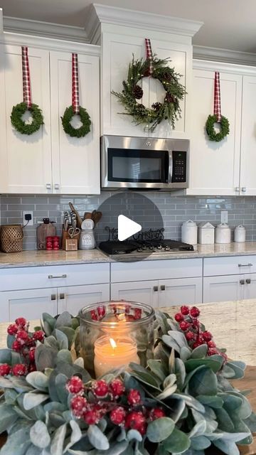 Liz Grella on Instagram: "One of the easiest ways to add cheer to your kitchen cabinets. I’ve also added just ribbon. But this is by far my favorite Christmas kitchen look.   I measure out the ribbon first-I recommend leaving it a little longer than you think you might need. I then use duct tape(yes, duct tape) on the inside of the cabinet. You can also use upside down command hooks. Duct has never damaged my cabinets. You can test it on a small area to make sure.   Comment WREATH for direct links sent directly to you. *Price for wreaths is for a set of 6!  #christmasdecor #christmasinspiration #christmasinspo #christmastime #christmasdecorating #christmaswreaths #christmaskitchen" Wreaths On Kitchen Cabinets, Michael Buble Christmas, Kitchen Wreath, Christmas Bows Diy, Christmas Decorations Apartment, Christmas Apartment, Christmas Tree Bows, Christmas Kitchen Decor, Christmas Themes Decorations