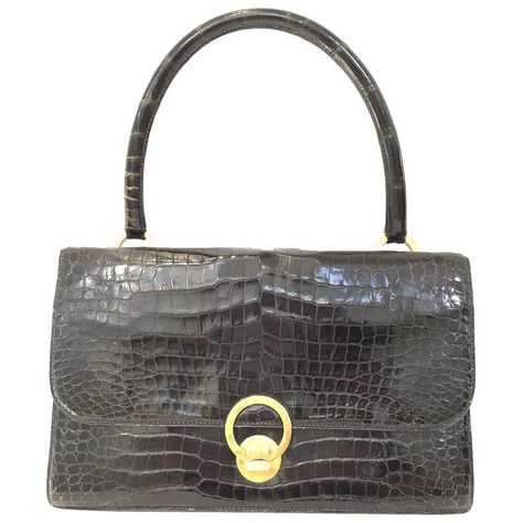 Vintage  Hermes crocodile purse | From a collection of rare vintage evening bags and minaudières at https://www.1stdibs.com/fashion/handbags-purses-bags/evening-bags-minaudieres/ Vintage Hermes Bag, Hermes Crocodile, Crocodile Purse, Alligator Handbags, Hermes Vintage, Crocodile Handbags, Vintage Leather Handbag, Vintage Evening Bags, Vintage Tote Bag