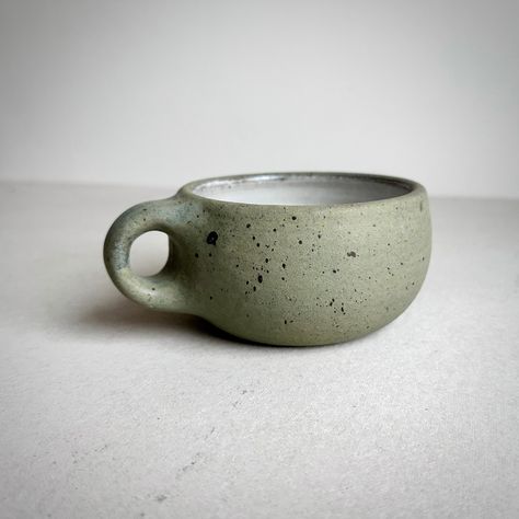 "MADE TO ORDER Round Mug Aged Green 4.5\" wide x 2.5\" tall / Holds approximately 11-12 oz. Your order will be added to my queue and it will take me 4-6 weeks from date of purchase to make before shipping out.  ** Pictures are just photos of the previous mug.  Each one is individually made so there will be slight variations in surface and shape. Please give me time to make enough pots to fill the kiln before firing so it's more energy efficient. Thanks :-)   Cappuccino or latte anyone?  Made to