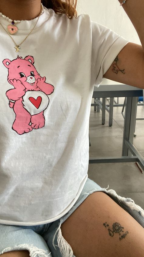 Custom Hand painted Pink care bear on a white T-shirt Care Bear T Shirt, Tshirt Painting Design Ideas, T Shirt Painting Aesthetic, Tee Shirt Painting Ideas, Clothes Painting Ideas Tshirt, Painted Tshirts Aesthetic, Painted Shirts Aesthetic, T Shirt Painting Ideas Aesthetic, Hand Painted Clothing T Shirts