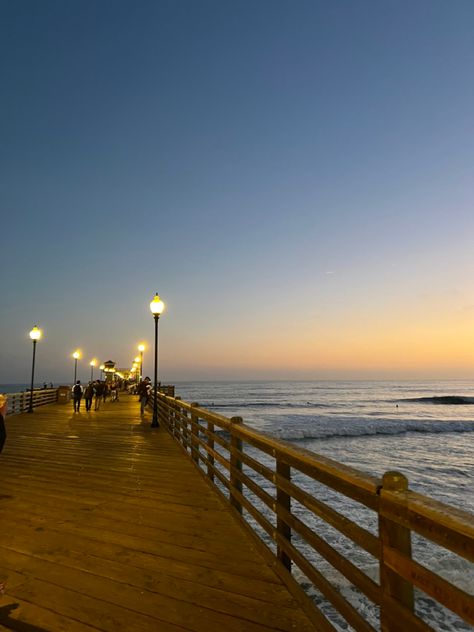 Summer Aesthetic Beach Sunset, Light Sunset Aesthetic, Beach Pier Aesthetic, Pier Sunset, Aesthetic Town Pictures, Beach Drive Aesthetic, Vintage Boardwalk Aesthetic, Boardwalk Lighting, Seaside City