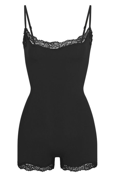 Love to lounge in this buttery-soft cami romper crafted with romantic lace trim from Kim Kardashian's SKIMS. Pull-on style Scoop neck Adjustable straps Lined gusset 76% polyamide, 24% elastane Machine wash, dry flat Imported Black Lace Romper Outfit, Pajama Bodysuit, Body Suit Shorts, Skims Outfit, Pj Romper, Black Loungewear, Girlfriend Clothes, Cami Romper, Body Suits