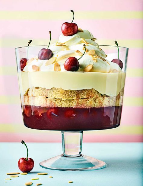 A staple on celebration tables up and down the country, the trifle dates back to the late 16th century. Consisting of fruity jelly topped with sponge, custard and cream, this popular British dessert is a classic for a reason! Our cherry trifle recipe is a showstopping dessert that can be made in advance, perfect for birthdays and dinner parties Plum Trifle, Cherry Trifle Recipes, Christmas Trifles, Dessert Trifles, Cherry Trifle, Scones And Clotted Cream, Summer Pudding, Trifle Recipes, Plum Recipes