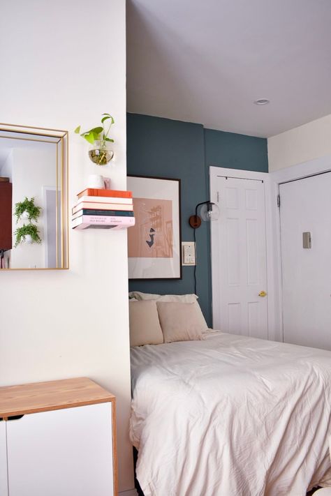 This tiny studio apartment has a smart layout that easily separates the bedroom from the living area and the dining area. We love the DIY plant wall and the table in the entryway. Harlem Apartment, Small Studio Apartment Decorating, Tiny Studio Apartments, Home Decor Apartment, Studio Apartment Living, Apartment Needs, Living Room Furniture Layout, Deco Studio, Small Studio Apartment