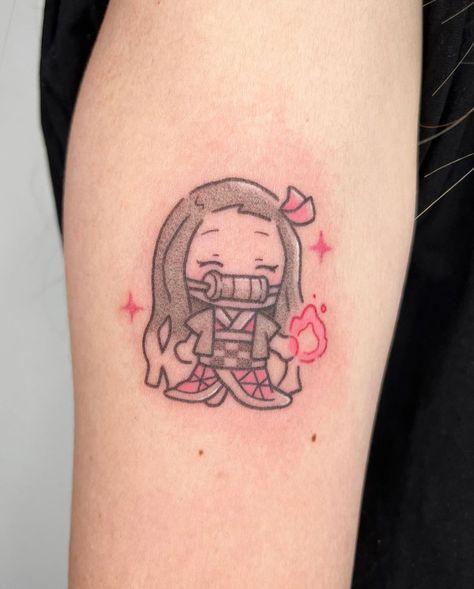 Tattoo by @pigeonpokes_ on Instagram, who is based in Singapore. Small Cute Japanese Tattoos, Cute Anime Tattoos For Women, Small Nezuko Tattoo, Subtle Naruto Tattoos, Anime Tattoo For Women, Anime Tattoos Women, Minimal Anime Tattoo, Nezuko Tattoo Ideas, Minimalist Anime Tattoos