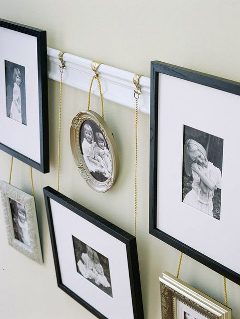 Try hanging your personal pictures in a unique way for a great way to update that blank wall: http://www.bhg.com/decorating/budget-decorating/cheap/low-cost-bedroom-updates/?socsrc=bhgpin011114hangpersonalizedartwork&page=8 Displaying Family Pictures, Photo Album Display, Wal Art, Picture Rail, Bedroom Updates, Picture Hook, Modern Victorian, Personalized Artwork, Picture Hanging