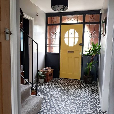 Striking bright yellow front door makes such a cheery entrance. We love these feature tiles which add some period charm to this property. Images from @ projectwaltonroad on Instagram. 1930s House Interior, 1930s House Renovation, Architecture Renovation, Hallway Colours, Hallway Inspiration, 1930s House, Hallway Flooring, Hallway Designs, Yellow Doors