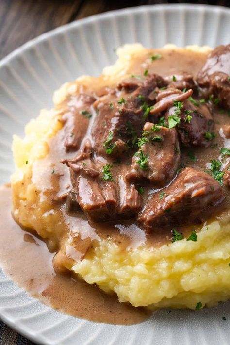 These no peek beef tips are a cozy dinner made with tender stewed beef that's simmered for hours in the crock pot. Do your best not to peek! #nopeek #beeftips #crockpot No Peek Beef, No Peek Beef Tips, Crock Pot Beef Tips, Stewed Beef, Beef Ideas, Beef Tip Recipes, Buttery Mashed Potatoes, Cookies And Cups, Beef Tips And Gravy