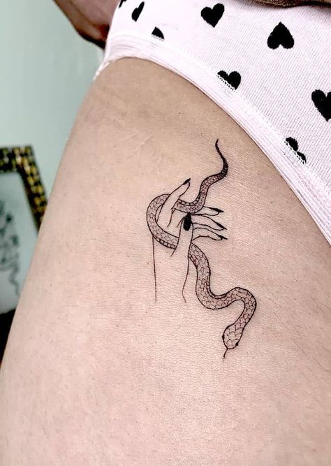 38 Small Meaningful Tattoos That Are Permanent Reminders Small Dope Tattoos, Small Snake Tattoo, Enough Tattoo, Nape Tattoo, Pride Tattoo, Awareness Tattoo, Tattoo Minimal, Boho Tattoos, Circle Tattoos