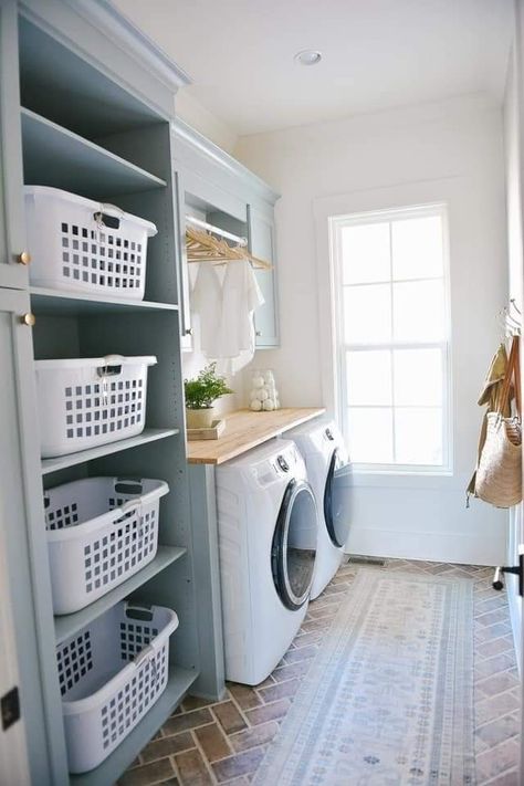 Laundry Room Storage Wall, Laundry Room Separator Ideas, Closet And Laundry Room Ideas, First Floor Laundry Room, Laundry Room Ideas With Sink In Middle, Laundry Room Basket Shelf, Laundry Room With Folding Area, Large Laundry Room Organization, Laundry Baskets In Laundry Room