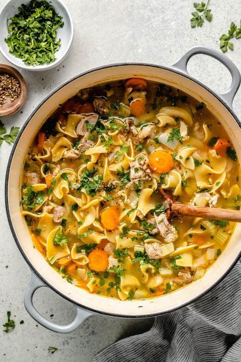 Leftover Turkey Noodle Soup is the perfect way to use up and repurpose those delicious holiday leftovers. Turn your leftover roasted turkey into a delicious and cozy soup that everyone will love. Leftover Turkey Noodle Soup, Turkey Soup From Carcass, All The Healthy Things, Leftover Turkey Soup, Turkey Noodle Soup, Turkey Holiday, Family Dinner Night, Cozy Soup, Turkey Soup Recipe