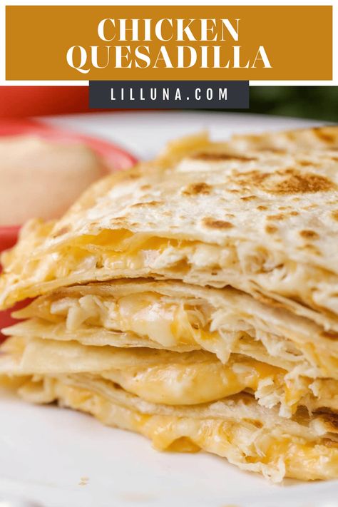 This easy, cheesy chicken quesadilla is a crowd favorite. Filled with a delicious homemade sauce, these hand-held bites are irresistible! #quesadillas #chickenquesadilla #mexicanrecipes #easydinners #dinnerideas Chicken Tender Quesadilla, Ground Chicken Quesadillas, Chicken Quessidla Recipes, Quasidia Recipes, Crockpot Chicken Quesadilla, Quasadias Recipes Chicken, Chicken Quesadillas With Rotisserie, Chicken Casadias Quesadilla Recipes, Quesilladas Recipe