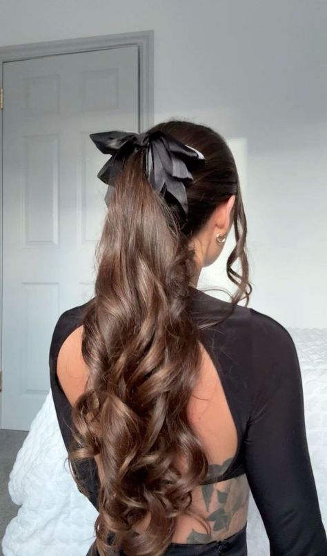 Show off your bold style with these beautiful hair ideas that are sure to turn heads. #BoldHair #BeautifulHair #HairStyleInspo Black Bow Ponytail, Ponytail Curls Hairstyles, Hairstyles For School Dances Curls, Curled Hair In Ponytail, Formal Hairstyles With Bow, Elegant School Hairstyles, Hairstyles With Black Bow, Ponytail Hairstyles For Wavy Hair, Curly Ponytail With Bow