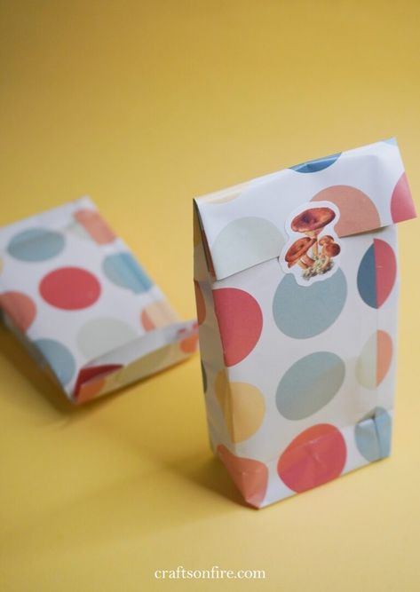 How To Make A Gift Bag From Patterned Paper - Craftsonfire Making A Bag With Wrapping Paper, How To Make Small Gift Bags Out Of Paper, Fold Gift Bag, How To Fold A Gift Bag, How To Make A Small Paper Bag, How To Make Gift Bags Out Of Paper, Diy Small Paper Bag, Diy Small Gift Bags, Wrapping Paper Gift Bag Diy