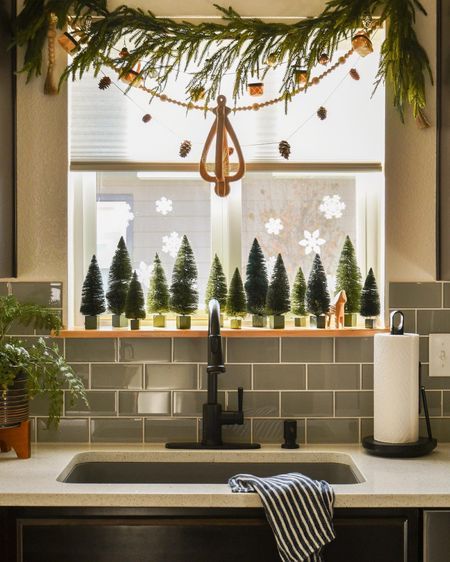 Sink Window Christmas Decor, Garland For Kitchen Window, Window Christmas Garland Ideas, Christmas Garland Around Kitchen Window, Bay Window Garland Christmas, Kitchen Bay Window Christmas Decor, Christmas Garland Over Kitchen Window, Garland Christmas Decor Window, Kitchen Christmas Window Decorations