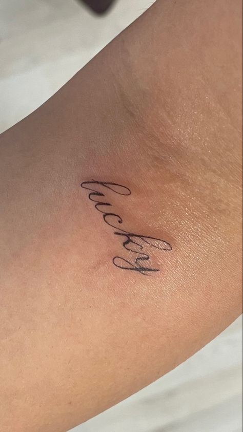 Tattoo Words For Woman, Lucky Cursive Tattoo, Make Good Choices Tattoo, Tiny Quote Tattoos For Women, Ethereal Word Tattoo, Paige Lorenze Tattoo, For Good Tattoo, Drake Inspired Tattoos, Lucky Tattoo Word