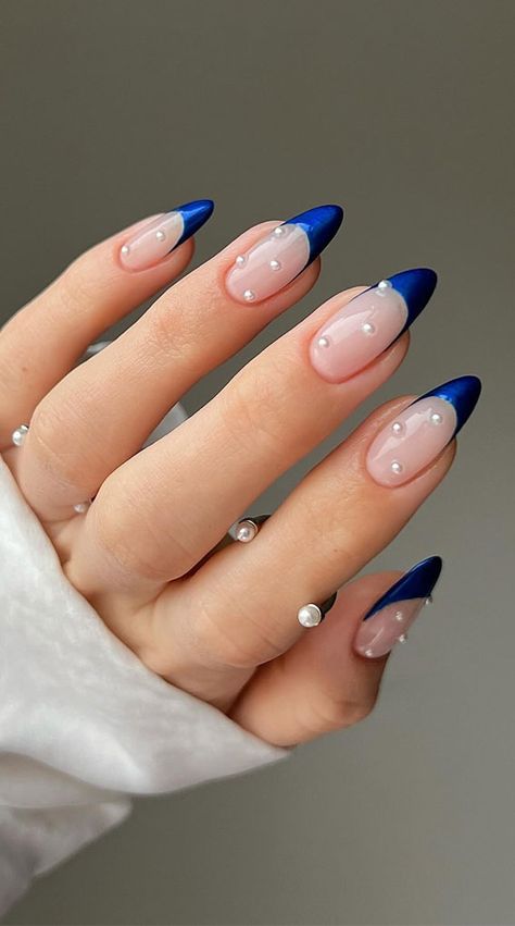 blue french tips with pearls, blue nails, butterfly blue nails, blue nail designs, blue nail art, blue nail ideas, mismatched blue nails, short blue nails, simple blue nails, almond blue nails Nail Art Designs Blue French Tips, French Nail Art Blue, Trendy Dark Blue Nails, Navy Blue Gem Nails, Navy Pearl Nails, Blue Glitter Fade Nails, Winter Nails Ideas Blue, Navy Blue Nails Homecoming, Navy Blue Nails With Pearls