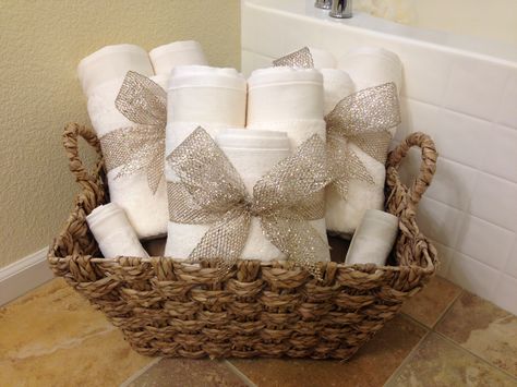 MY BEAUTIFUL TOWEL BASKET!!! Very easy to do! Just get the towels and ribbon! I stuck a pillow under the towels so they were higher in the basket! I got the extra large basket from Home Goods!! DIY Guest Bathroom Towels Display, Rolled Towels Bathroom, How To Hang Towels In Bathroom, Diy Bathroom Baskets, How To Hang Towels, Bathroom Towels Display, Guest Bathroom Towels, Hang Towels In Bathroom, Towel Display