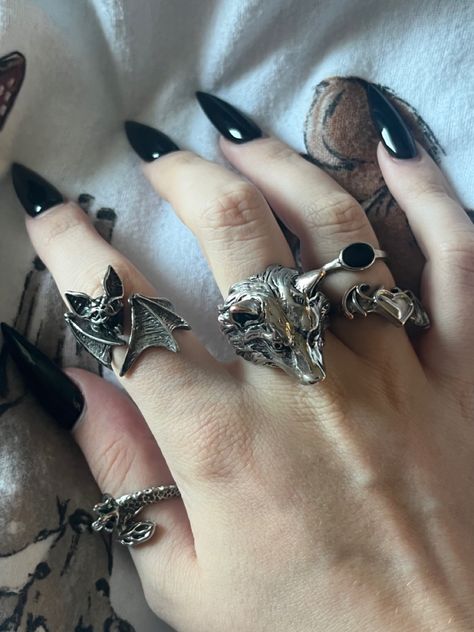 silver rings bat wolf jewellery aesthetic Werewolf Jewelry Aesthetic, Silver Goth Rings, Emo Rings Aesthetic, Goth Aesthetic Jewelry, Vampire Accessories Aesthetic, Rings Goth Aesthetic, Dark Accessories Aesthetic, Wolf Core Aesthetic, Gothic Jewelry Aesthetic