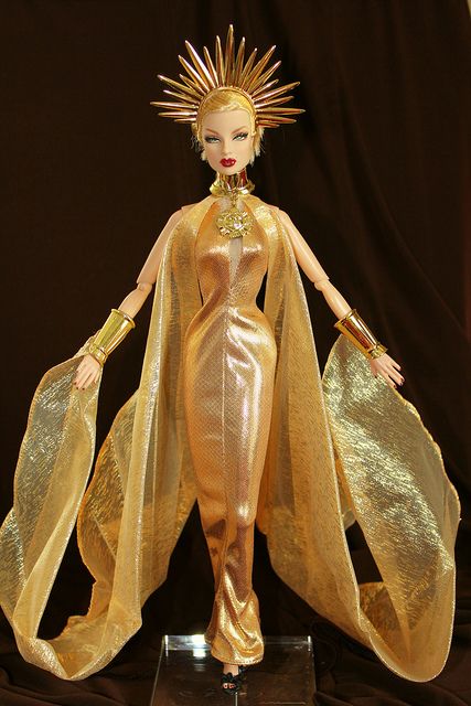 Morning  Sun  Princess  In  Full  Regalia  Eugenia  Perrin  Frost  is  wearing  a  fantasy gown  from  the  Morning  Sun  Princess  2000  barbie.  Its  part  of the  Celestial  Goddess  Collection  and  Mystical  Princess  of  the Sky. Sun Goddess Costume, Sun And Moon Costume, Sun Princess, Barbie Design, Moon Costume, Goddess Costume, Golden Goddess, Fantasy Gowns, Fashion Royalty Dolls