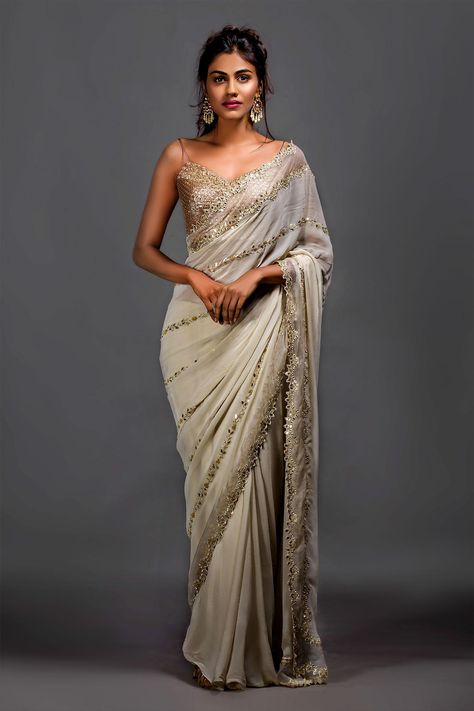 Shop for Izzumi Mehta White Brocade Zardozi Embroidered Saree And Blouse for Women Online at Aza Fashions Luxury Saree With Padded Blouse For Reception, Luxury Bollywood Saree With Pallu, Luxury Semi-stitched Saree With Dabka, Luxury Elegant Saree With Handwork, Luxury Georgette Saree For Formal Events, Luxury Bollywood Blouse With Mirror Work, Luxury Zari Work Saree With Side Open, Luxury Georgette Party Wear Saree, Luxury Bollywood Saree For Spring