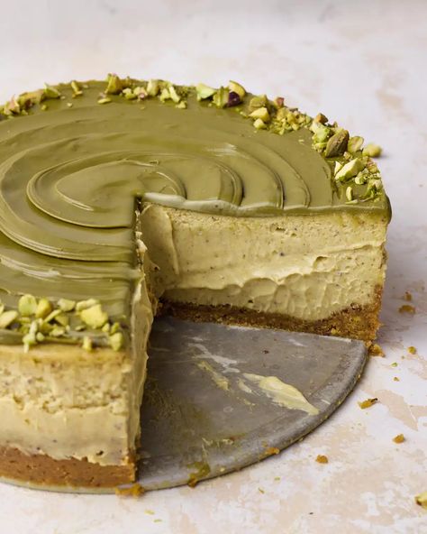 This easy pistachio cheesecake is a baked cheesecake with pistachio graham cracker crust, pistachio cheesecake filling and topped with pistachio cream and chopped pistachios. With pistachio paste in the cheesecake batter and pistachio cream on top, this delicious dessert is packed with pistachio flavor. Delicious dessert for dinner parties or holidays. Easy Pistachio Cheesecake Recipe, Honey Pistachio Cheesecake, Best Pistachio Dessert, Pistachio Gift Ideas, Cheesecake Recipes Pistachio, Pistachio Cream Cheesecake, Chocolate Pistachio Dessert, Pistachio Butter Recipe Ideas, Pistachio Basque Cheesecake