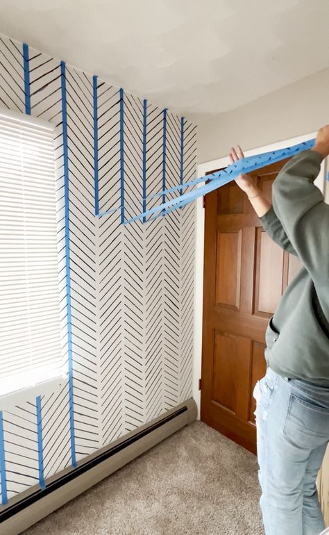 Transforming a room doesn't have to break the bank. In January 2023, my friend and I took on a fun DIY project to revamp our friend's nursery, and the results were nothing short of amazing....and it only cost $5!! With a simple yet effective technique, we were able to create a modern herringbone-style design that Easy Wall Murals Painted Diy Boho, Boho Stencil Wall, Geometric Wall Wood Diy, Simple Painted Wall Design, Chevron Painted Wall, Painted Lines On Walls Ideas, Diy Slate Wall, Paint Patterns On Wall, Sponge Accent Wall Diy