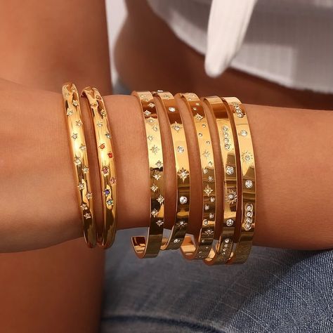 🛍️✨ Discover our dazzling Gold Bangle Collection! These stunning pieces, adorned with sparkling stars and gems, are perfect for any occasion. Stack them up for a bold statement or wear them solo for a chic, minimalist look. Ready to shine? ✨ 🌟 Why You’ll Love Them: • Luxurious gold finish • Beautiful star and gemstone detailing • Versatile and stackable design Shop now and add a touch of elegance to your everyday style!🌟 🛒https://shorturl.at/pYOqu #JewelryLovers #BangleBracelets #Acce... Star Bangle, Sparkling Stars, Gold Plated Bangles, Stainless Steel Bangles, Bangles Bracelets, Cuff Bangle Bracelet, Stacked Bangles, Freshwater Pearl Bracelet, Gold Bracelet Cuff