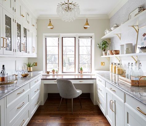 You might be able to further justify adding a butler's pantry to your home if you're able to get even more mileage out of this space. One great way to do just that is to incorporate desk space for working in peace. Zaveloff designed this walk-in pantry with a desk placed underneath a sunny window. #organization #cleaning #marthastewart Walk In Pantry With Windows, Walk In Pantry With Desk, Butler Pantry Office Combo, Butlers Pantry Office Combo, Desk In Pantry, Butlers Pantry With Desk, Pantry With Desk Area, Walk In Pantry With Window, Pantry With Desk