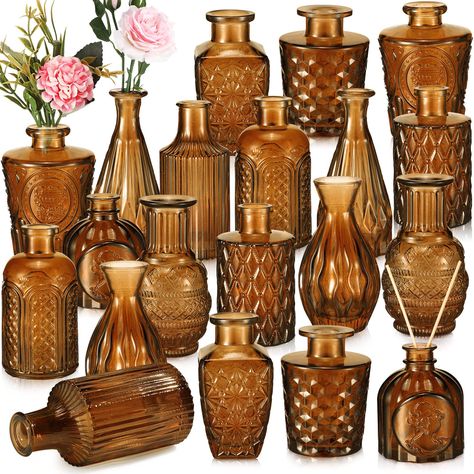 PRICES MAY VARY. Rich in Quantity: this package comes with 20 pieces of small centerpiece vases in 10 styles, the quantity is sufficient to meet your home decoration needs, you can also share them with others; Each vase is firmly wrapped in the thick boxes to avoid breakage in transit Retro Design: the glass vases for centerpieces are decorated with etching patterns, look retro and elegant, they will become the delicate centerpieces for the window, dining or wedding table Easy to Store and Displ Fall Wedding Ideas Table Decor, Terracotta And Black Wedding Table Settings, Brown Glass Centerpiece, Fall Wedding Guest Table Ideas, Moon Wedding Centerpieces, Amber Glass Wedding Decor, Vintage Centerpiece Wedding, Autumn Wedding Centerpieces, Marriage Planning