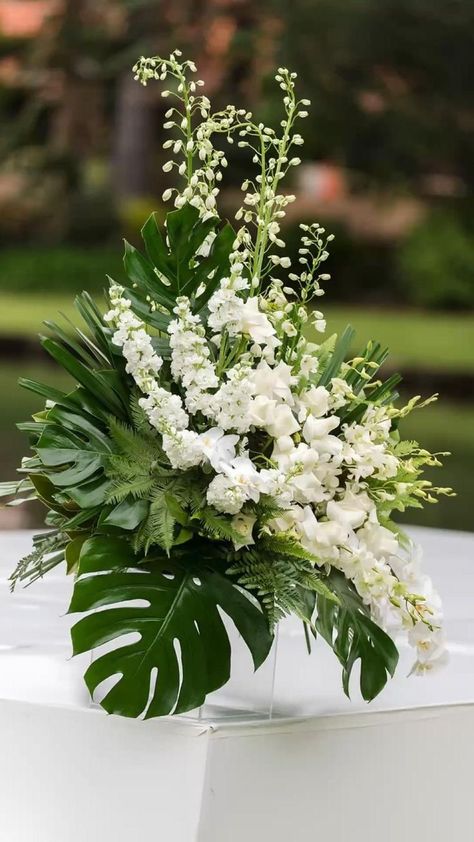 Table centerpieces in 2022 | Tropical wedding centerpieces, Tropical flower arrangements, Wedding flower arrangements White Wedding Ceremony Flowers, Elegant Ballroom Wedding, Waterfront Wedding Ceremony, Green And White Wedding, Elegant Ballroom, Leaves Photography, White Wedding Ceremony, Tropical Wedding Theme, Tropical Floral Arrangements