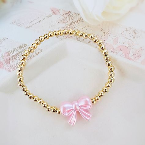 Gorgeous 14k Gold Plated 4mm Beaded Bracelet With A Pink Pearl Bow Bead Perfect Bracelet To Wear Alone Or Stacked With Other Favorite Pieces Bracelet Measures Approximately 7 Inches This Is For One Bracelet Only Tags: Preppy, Coquette, Pearls, Pink Bow, Spring Fashion, Gift For Her, Easter, Trend, Trendy, Love Shack Fancy, Stoney Clover Lane, Enewton, Mean Girls, Couqutte Jewelry, Love Shack Fancy Jewelry, Summer Jewelry Stack, Cute Party Favors For Teens, Preppy Stuff To Get For Your Birthday, Fancy Beaded Bracelets, Easter Beaded Bracelets, Coquette Beaded Bracelet, Cute Bracelet Stacks