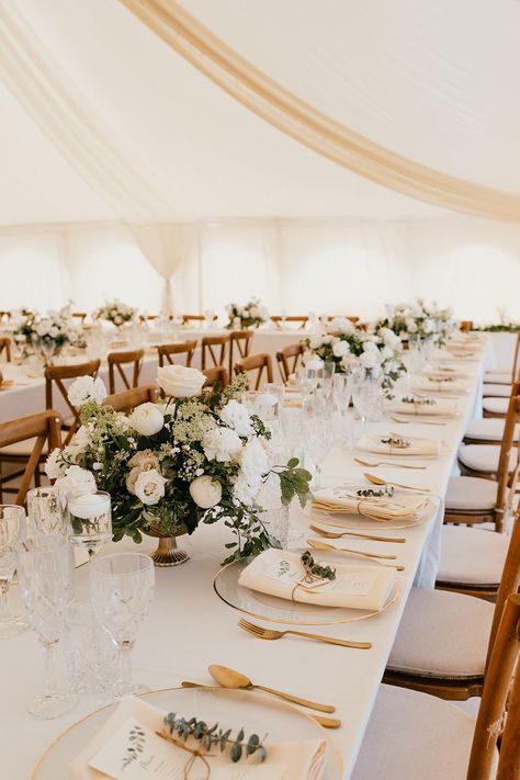 Banquet tables complete with white tablecloths, white floral arrangements and gold cutlery finished with fabric napkins tied with brown string Wedding Table Champagne Color, Beige Wedding Theme Table Settings, Wedding White And Beige, Brown Table Wedding Decor, Wedding Table Dressing, Wedding Banquet Table Decorations, Wedding Table White Tablecloth, Engagement Table Set Up, White Linen Wedding Table