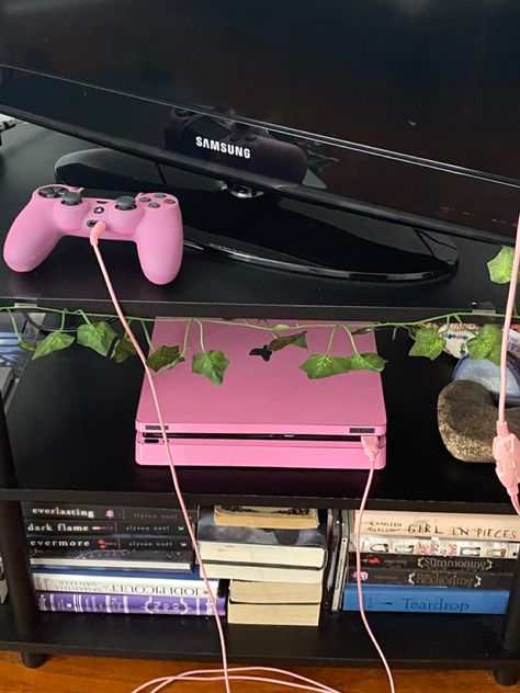 #pink #playstation #ps4 #pinkps4 #pinkplaystation #tropical #vines #books #gamesetup #roominspiration #aesthetic #ps4skin #skin Pink Playstation, Tropical Vines, Pink Games, Ps4 Skins, Pink Lifestyle, Nintendo Switch Accessories, Pink Life, Gaming Room Setup, Cute Room Ideas