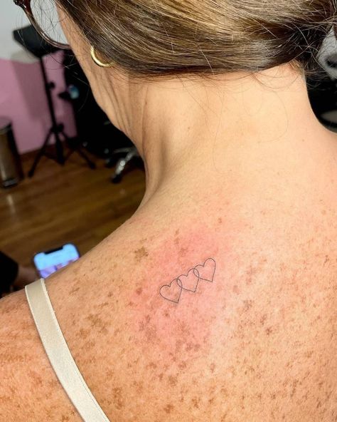 Three little hearts tttooed on the upper back, fine Hearts Tattoo Designs, Three Hearts Tattoo, Sister Heart Tattoos, Three Sister Tattoos, 3 Hearts Tattoo, Two Hearts Tattoo, Love Heart Tattoo, Hearts Tattoo, Small Heart Tattoos