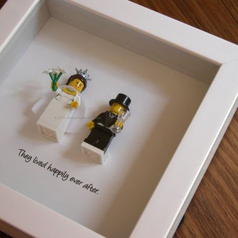 Art frame feature two LEGO®️️ minifigures, Bride and Groom with the a quote: ‘They lived happily ever after beneath. Its the perfect gift for Lego Wedding, Homemade Wedding Gifts, Wedding Gifts For Bride And Groom, Diy Wedding Gifts, Homemade Wedding, Best Wedding Gifts, Wedding Engagement Gifts, Lego Minifigure, Married Couples