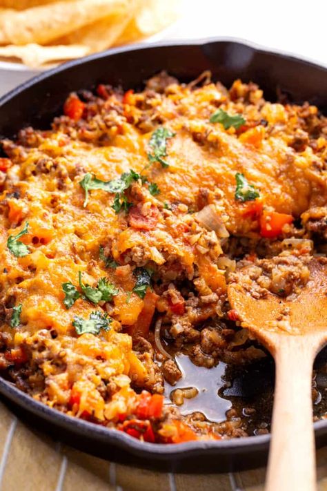 This amazing Mexican cauliflower rice is full of tasty seasonings, hearty ground beef, and lots of healthy veggies. It is the perfect one-pot dinner that you can feel good about eating.  This cauliflower rice recipe is going to completely transform Mexican night in your house. It is healthier than regular rice bowls and also easier… The post Loaded Mexican Cauliflower Rice appeared first on All Things Mamma. Riced Cauliflower Taco Bowl, Low Carb Burrito Bowl Cauliflower Rice, Keto Mexican Riced Cauliflower, Chorizo Cauliflower Rice, Riced Cauliflower Spanish Rice, Ground Beef Cauliflower Rice Recipes, Cauliflower Rice Beef Recipes, Recipes With Riced Cauliflower Low Carb, Burrito Bowl With Cauliflower Rice