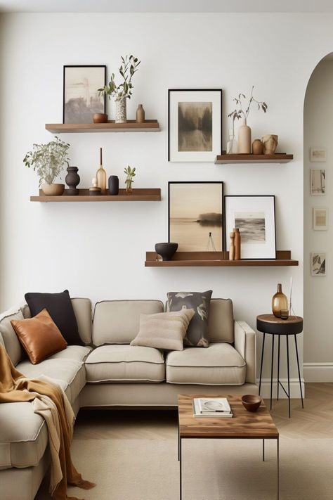 Shelf With Paintings, Plain Walls Ideas, Gallery Wall With Greenery, Sitting Room Wall Ideas, Plain Wall Living Room Ideas, Picture Wall Ideas Shelves, Homey Earthy Living Room, Uneven Floating Shelves, Textured Wall Decor Ideas