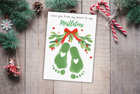 Spread holiday cheer with our Mistletoe Christmas Footprint Handprint Craft! 🎄✋ Engage kids in a festive and creative school activity, creating delightful holiday DIY cards. This craft transforms into a memory keepsake and thoughtful gift, capturing the magic of the season. Utilize the printable template to make it a hassle-free and joyful art project for kids. Craft memorable moments together this holiday season! 🌟👶 #ChristmasCrafts #HandprintCraft #DIYHolidayKeepsake Mistletoe Kids Craft, Missle Toe Christmas Diy, Miseltoe Crafts For Kids, Misotoes Christmas, Mistletoes Craft, Christmas Handprints, Mistletoes Footprint, Mistletoe Craft, Mistletoes Footprint Craft