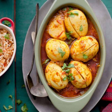 Punjabi Egg Curry Eggs And Potatoes, Tomato Gravy, Egg Curry, Fenugreek Leaves, Dried Mangoes, Red Chili Powder, Cinnamon Powder, Coriander Powder, Steamed Rice