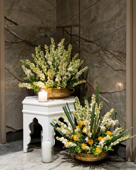 This entrance is a perfect combination of traditional splendour and elegance. We used a foliage of Rajnigandha, bright sunflowers, Marigold, Birds of Paradise and Sevanti flowers in brass and ceramic pots to create this look. . . . Decor - @wedfieldevents Entertainment- @wedfieldevents Photography -@wedfieldphotography . . #wedfield #destinationweddings #destinationwedding #decor #luxurywedding #weddingmoments #WeddingDecorTrends #WeddingDecorLove #WeddingFurniture #WeddingStyle #day... Rajnigandha Flower Decor, Marigold Decor, Indian Floral Decor, Couple Seating, Ganpati Decoration Theme, Home Flower Decor, Night Wedding Decor, Decoration Theme, Indian Theme