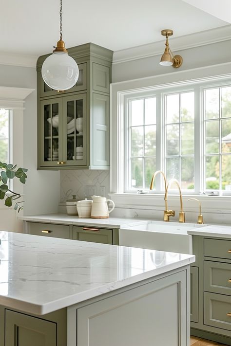 Sage green works beautifully in both traditional and contemporary kitchen designs, adding a subtle touch of color. Click to see more ideas. Modern Farmhouse Kitchens Sage Green, Painted Cabinets Kitchen Ideas, Home Decor Ideas Timeless, Green Small Kitchen Ideas, Sage Country Kitchen, Green And White Kitchen Cabinets Modern, Shaker Kitchen Sage Green, Sage Color Kitchen Cabinets, Pale Sage Kitchen