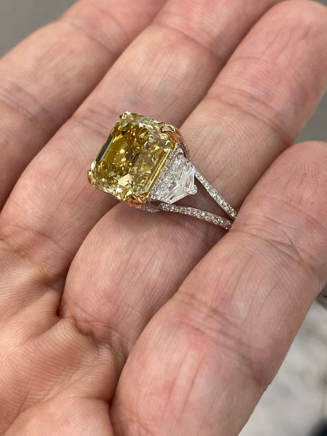 RAYO -ASSCHER CUT NATURAL FANCY YELLOW DIAMOND ENGAGEMENT RING BY MIKE NEKTA GIA CERTIFIED Center Diamond:Carat Weight: 10.2 Carats Color Grade : FANCY BROWNISH YELLOW Color Origin : NATURAL Color Distribution : EVEN Clarity: VVS2 Style: ASSCHER / SQUARE EMERALD CUT Approximate Measurements: 12.0 x 11.5 x 7.8 mm Ring: Metal: 18K GOLD Style: THREE STONE ASSCHER DIAMOND RING, MICRO PAVE SPLIT SHANK Diamonds: 1.5 carats Size: Can be adjusted to any size. Engagement Rings Asscher, Gold Diamond Ring Engagement, Asscher Cut Ring, Yellow Diamond Ring, Canary Diamond, Brownish Yellow, Yellow Diamonds Engagement, Yellow Diamond Engagement Ring, Asscher Diamond