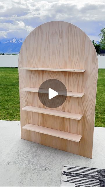 Sadie Eliason on Instagram: "This was such a fun Saturday project! Make sure you’re following for more party projects coming soon! All wood and supplies are from @loweshomeimprovement 💙   #firstbirthdayparty #birthdayparty #woodbackdrop #archbackdrop #floatingshelves #firstbirthdayideas #basketballparty #sportsbirthdayparty" Diy Backdrop With Shelves, Displaying Photos At A Party, Wood Backdrops For Parties, Wooden Backdrops For Parties, Diy Wooden Backdrop Stand, Wood Party Backdrop, Diy Treat Wall, Diy Wooden Backdrop, Diy Party Arch