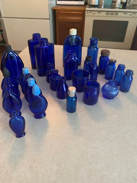 This is a nice collection of 28 assorted cobalt blue glass bottles. Some have tops. Most do not. Perfect for any window where you need an instant sun catcher. Glass Perfume Bottles, Freebies By Mail, Blue Glass Bottles, White Decoration, Cobalt Glass, Antique Bottles, Baby Blues, Blue Bottle, Kitchen Inspo