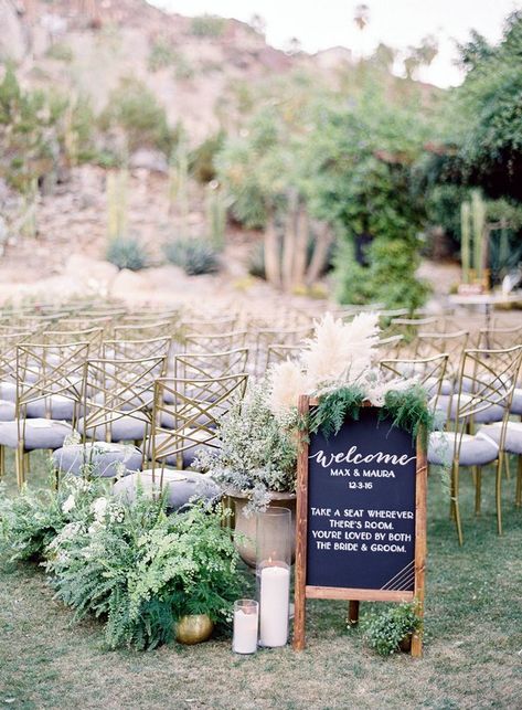 Create an inviting scene as guests arrive at the ceremony. In addition to a sweet sign, add a variety of lush potted ferns and grasses, as well as glowing candles, to greet guests as they take their seats. Ceremony Entrance, Vasos Vintage, Potted Ferns, Wedding Ceremony Ideas, Romantic Outdoor Wedding, Wedding Ceremony Signs, Ceremony Signs, Welcome Signs, Wedding Aisle