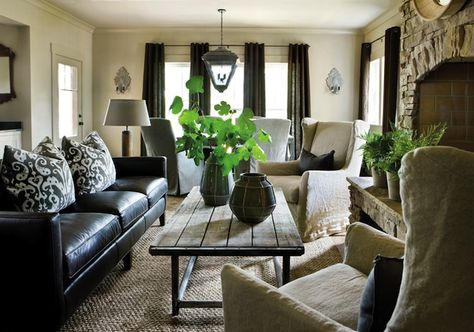 How to make leather couches cozy: team with distressed wood, linen covered wingback chairs, sizal rug and a touch of greenery to freshen it up. Black Leather Sofa Decor, Black Leather Sofa Living, Sectional Decor, Black Leather Living Room, Leather Sofa Decor, Black Leather Furniture, Black Couch Living Room, Black Sofa Living Room, Leather Sofa Living