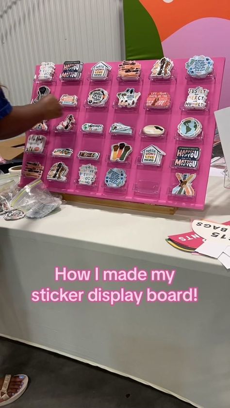 My DIY sticker display board courtesy of @Smile Cult’s tutorial 🫶🏾 r... | Diy Stickers | TikTok Best Vendor Booth Ideas, Display Stickers For Sale, Craft Booth Sticker Display, Sticker Vendor Booth Display Ideas, How To Display Car Decals At Craft Show, Sticker Display Ideas Retail Diy, Pegboard Sticker Display, Ways To Display Stickers For Sale, Peg Board Sticker Display